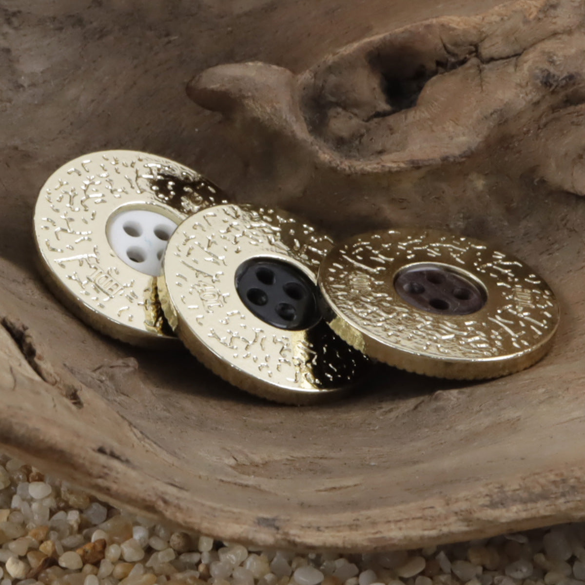 Double-sided two-tone suit buttons with beige and dark resin faces, gold-toned trim