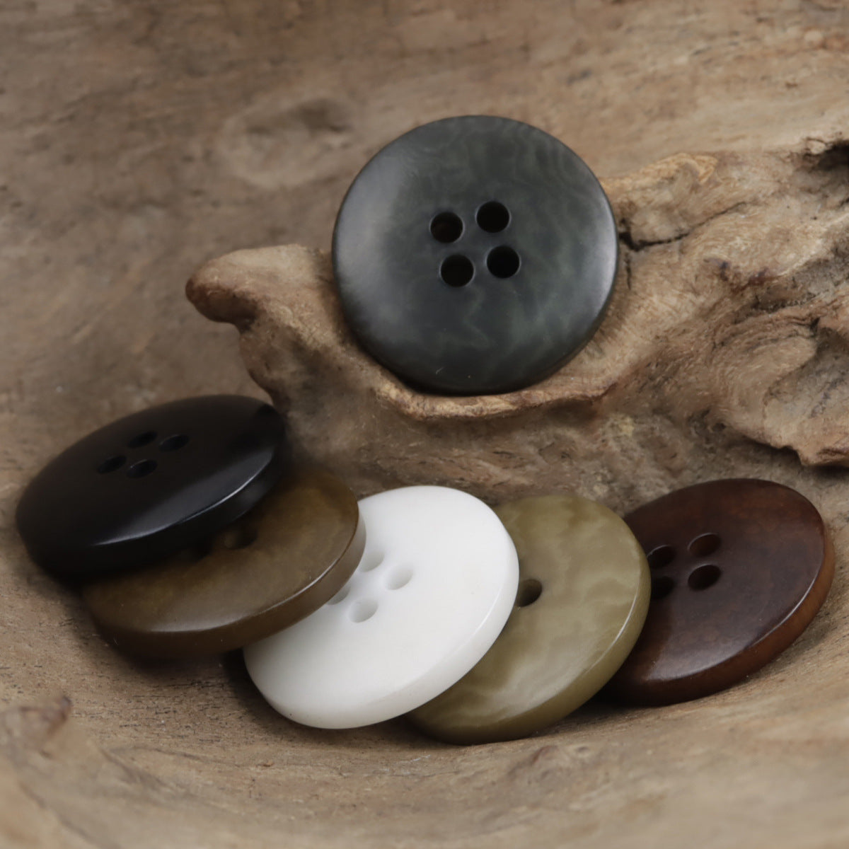 Round tagua nut buttons in white, dark gray, brown, and khaki tones, 10-pack