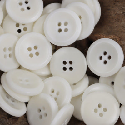 White round tagua nut buttons with four-hole design, pack of 10
