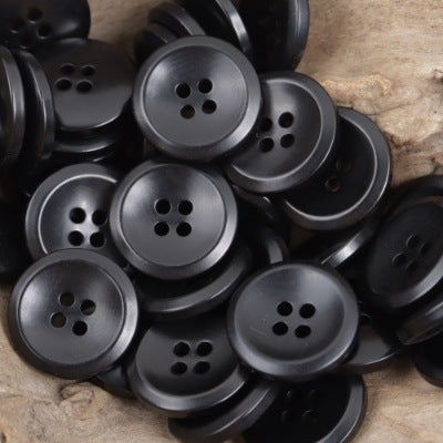 Black round tagua nut buttons with four-hole design, 10-pack
