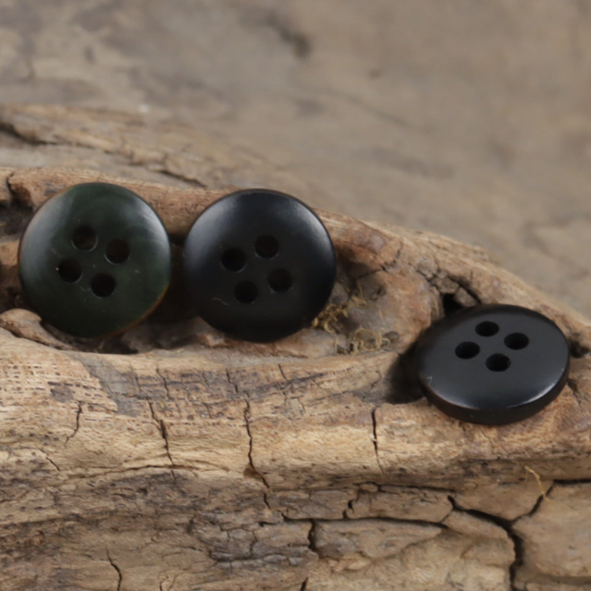 Set of dark green 4-hole fruit buttons, 3 buttons on a rustic wood piece