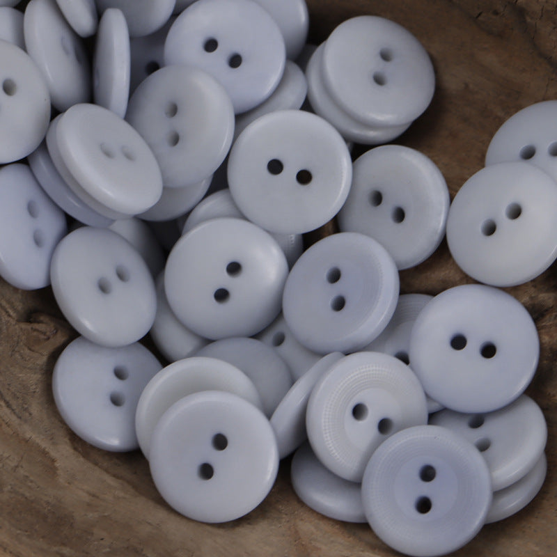 Light blue corozo-style round 2-hole buttons, assorted pack