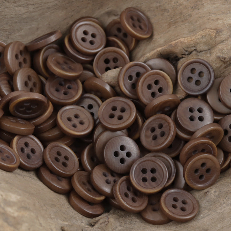 Natural fruit buttons pile in brown tones, round fronts with four holes