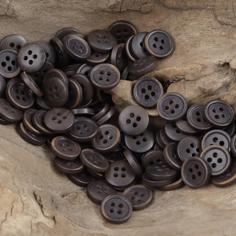 Natural fruit buttons pile, dark mixed tones, round fronts with four holes