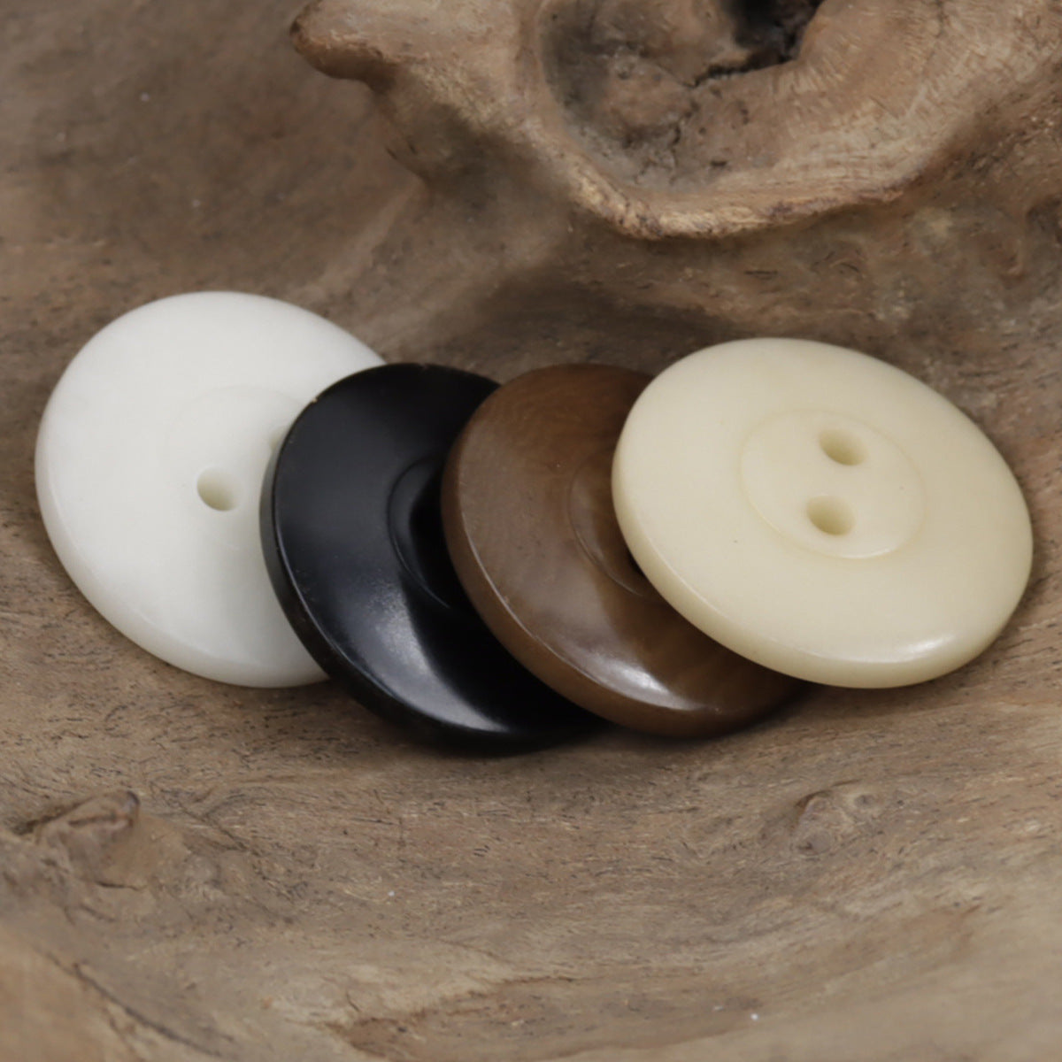 Two-hole octagram tagua nut buttons in white, black, coffee, and natural cream tones