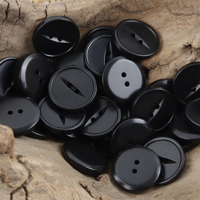 Round two-hole corozo buttons, black, multiple pieces