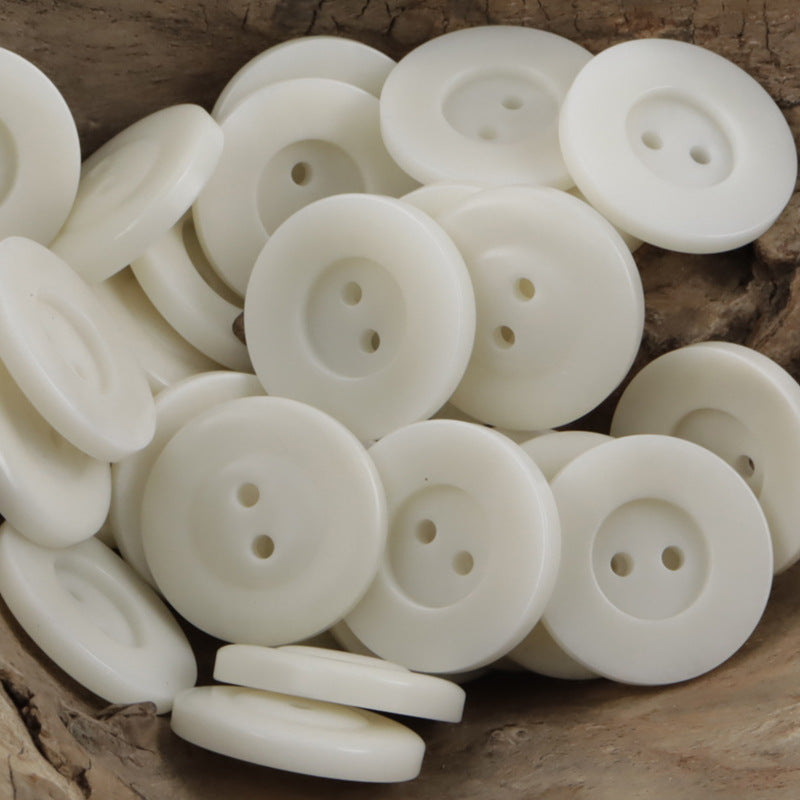 Classic two-hole nut buttons in white, round with 2 holes; 10 pcs