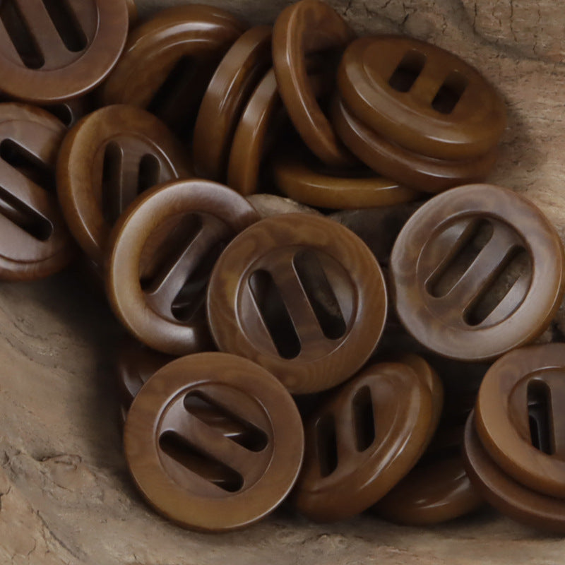 Coffee brown long-eye slider buckle buttons, round with long oval slots.