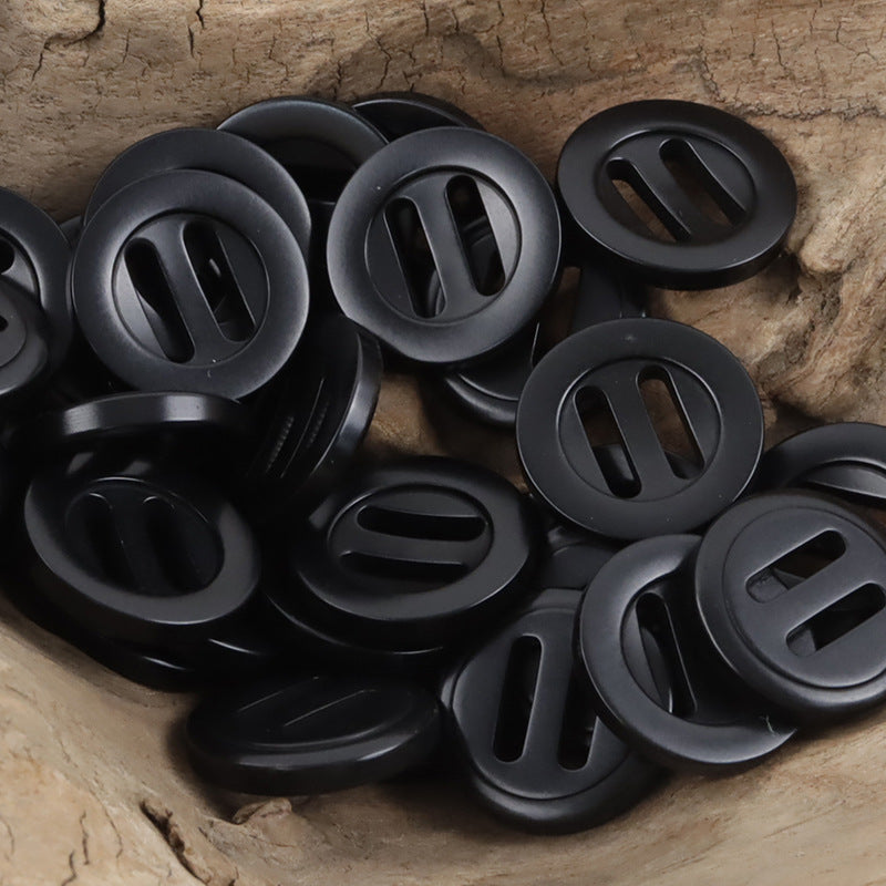 Black long-eye slider buckle buttons, round with long oval slots.