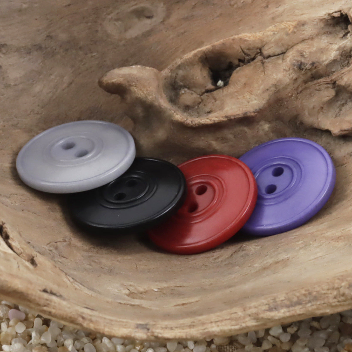Dual-circle tagua nut buttons: light gray, black, red, purple
