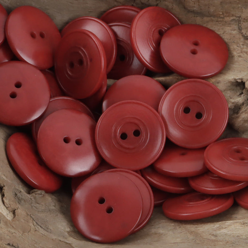 Red dual-circle tagua nut buttons with two-hole design (10 pcs)