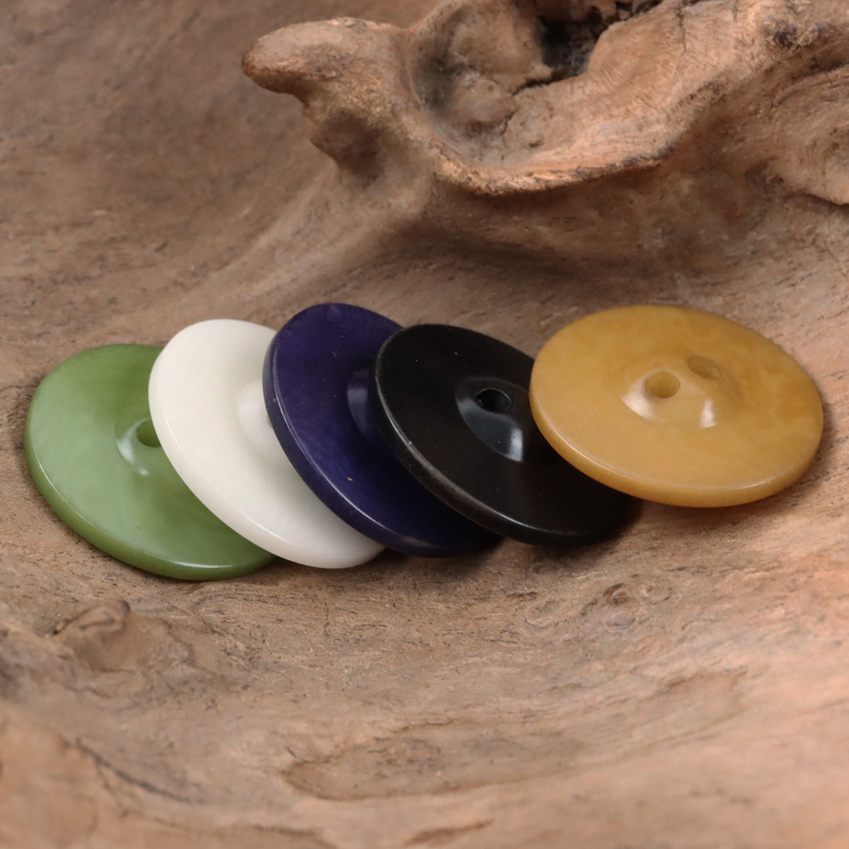 Chessboard UFO buttons in green, white, purple, black, and tan