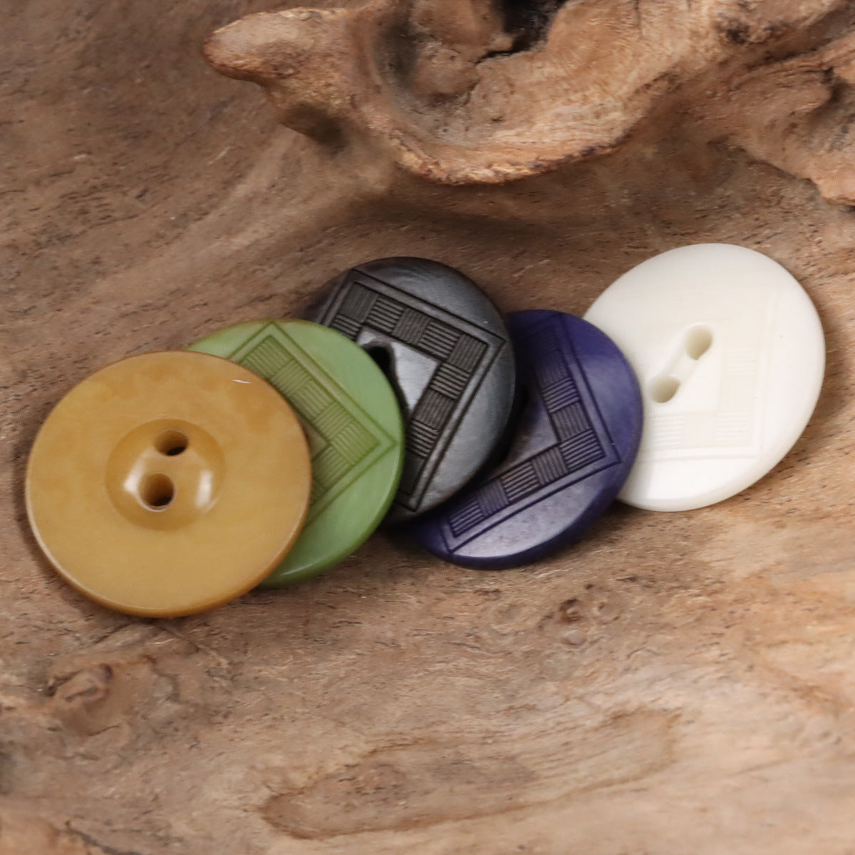 Tagua nut chessboard buttons in tan, green, dark gray, purple, and white