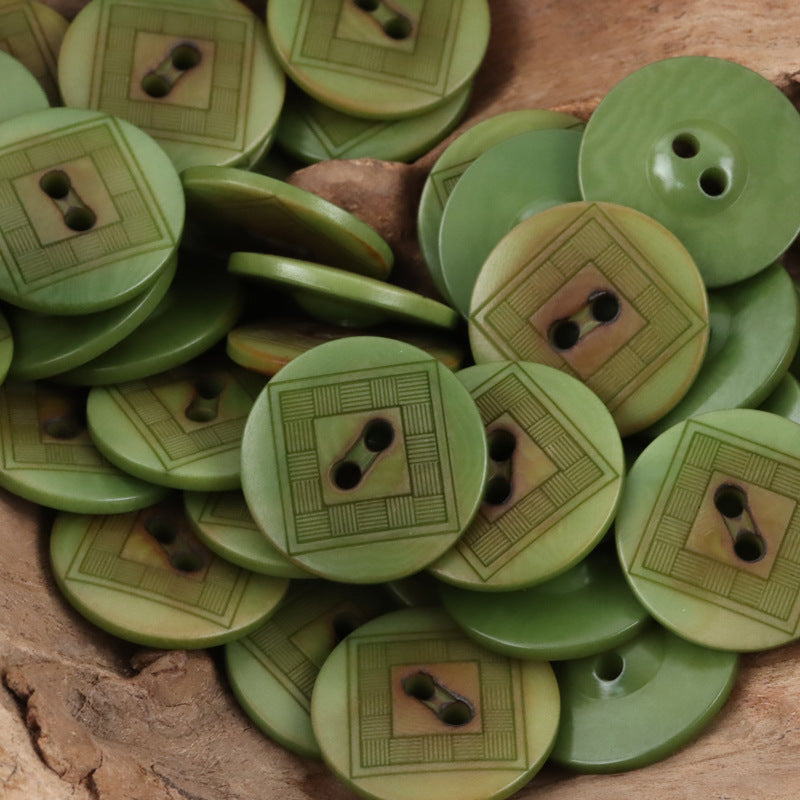 Green chessboard tagua nut button with two holes, rounded face