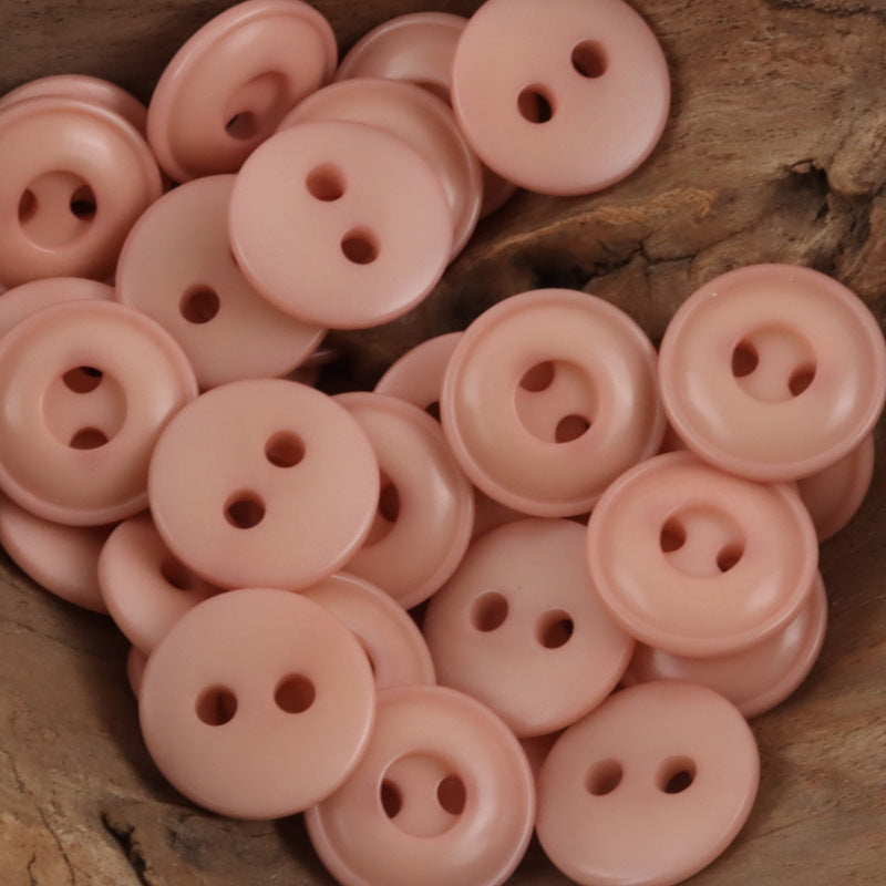 Blush pink two-hole tagua nut buttons, flat round with two holes