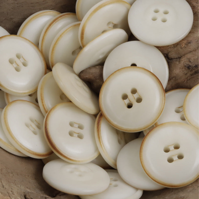 Burnt beige tagua nut buttons: cream fronts with light tan edges and 4-hole styling