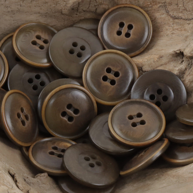 Gray-brown fire-burned tagua nut buttons: matte round fronts with 4 holes and rim
