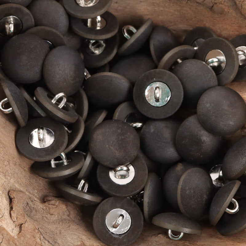 Matte black fruit buttons with metal stems, silver metal inserts visible