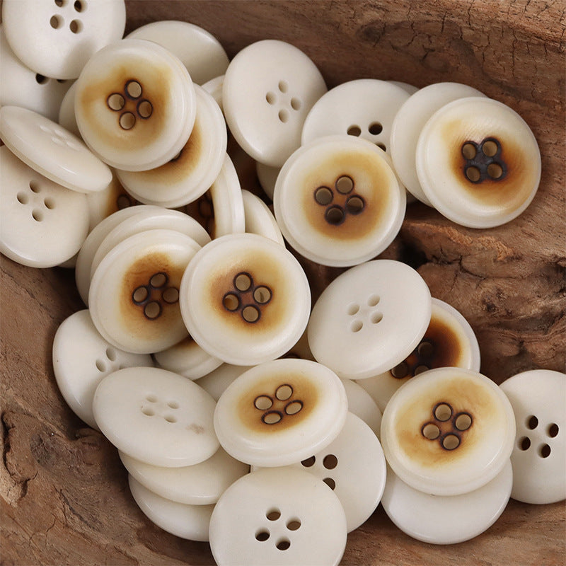 Mixed natural nut buttons bundle, paw and 4-hole designs, creamy white with amber tint