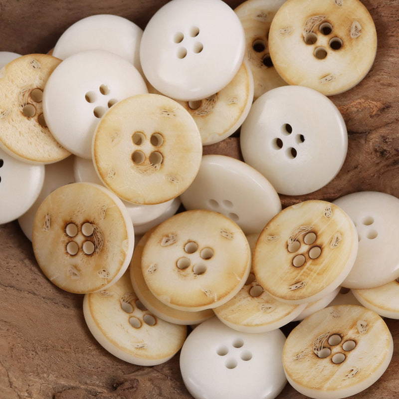 Cream beige round 4-hole nut buttons with etched leaf pattern