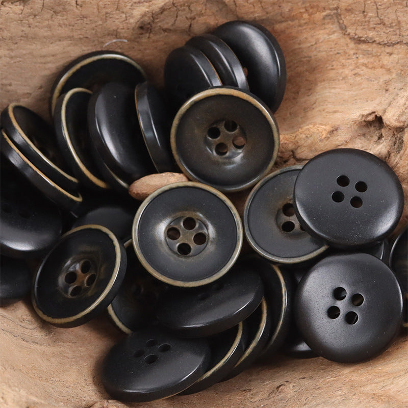 Black nut-style coat buttons, bowl-shaped, each with 4-hole face