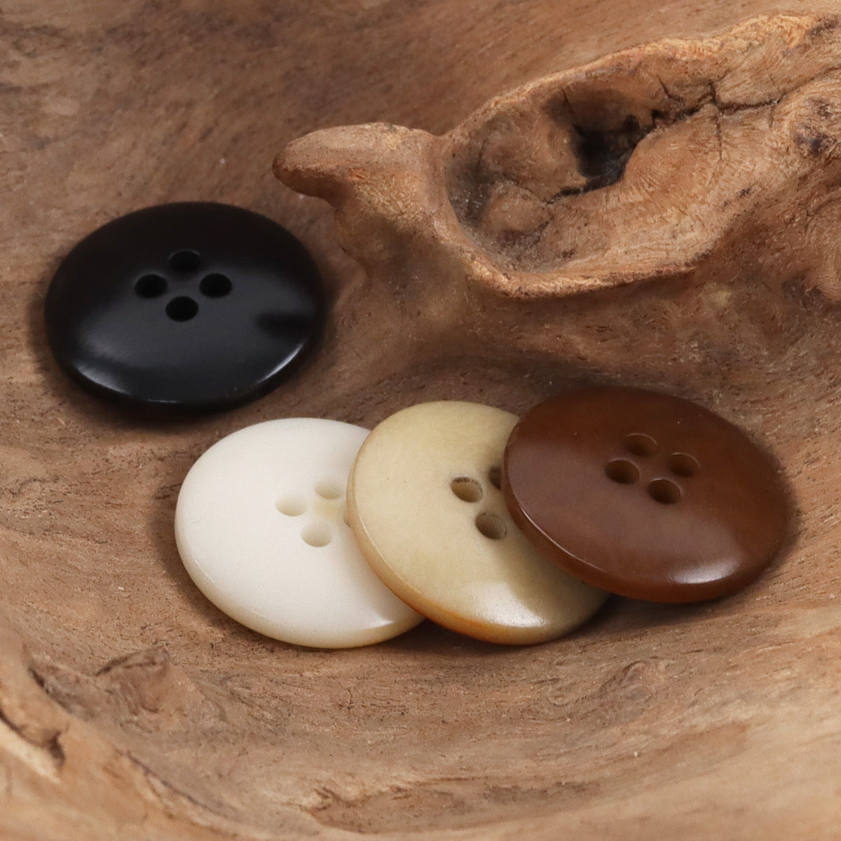 Palm fruit button mix in dark brown, black, cream and tan, each with 4-hole design