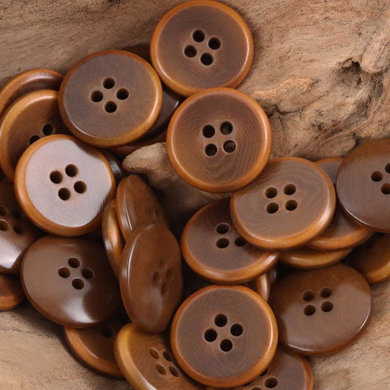 Caramel palm fruit buttons assortment in brown shades; round faces with 4-hole centers