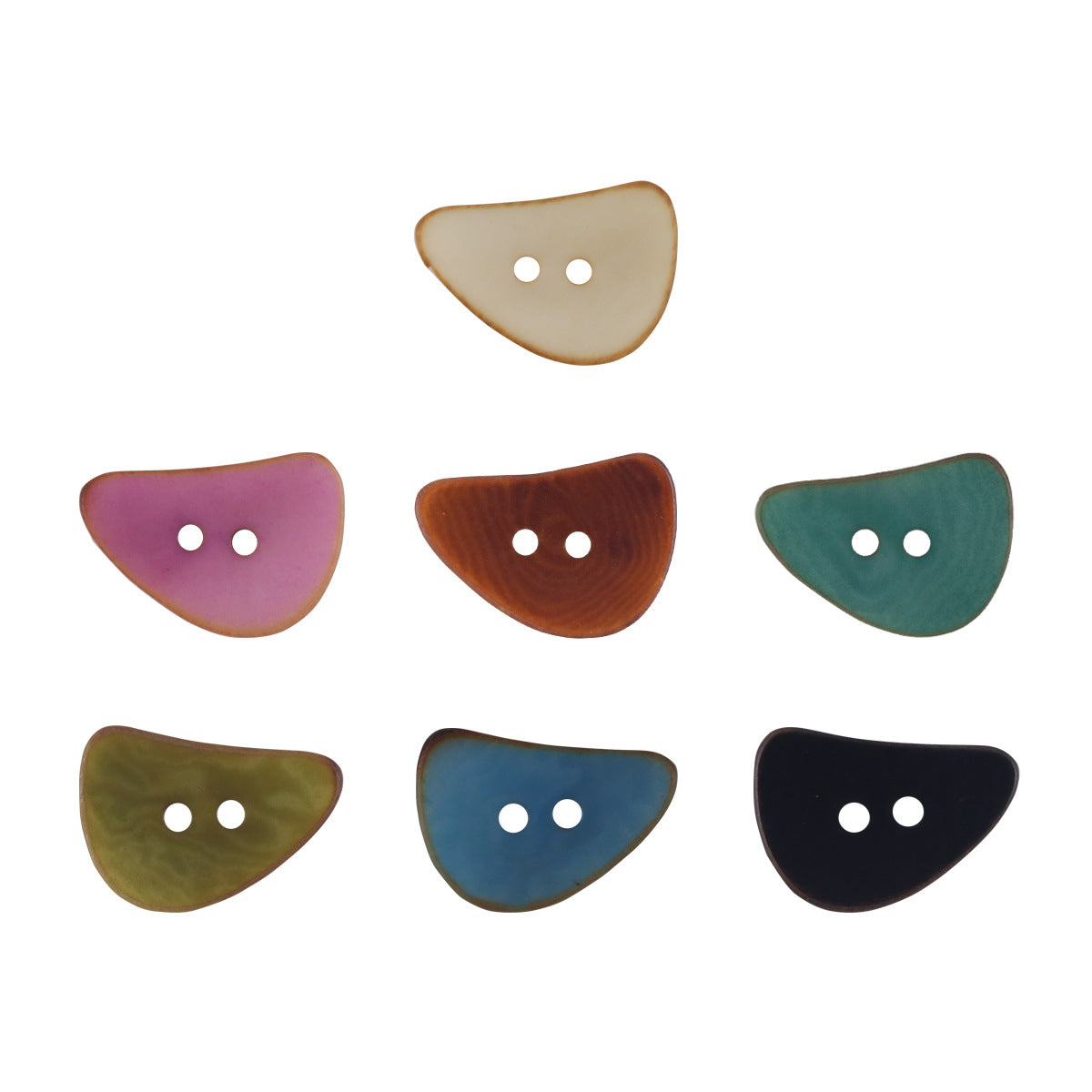 Assorted crescent moon corozo buttons with two holes, mixed colors