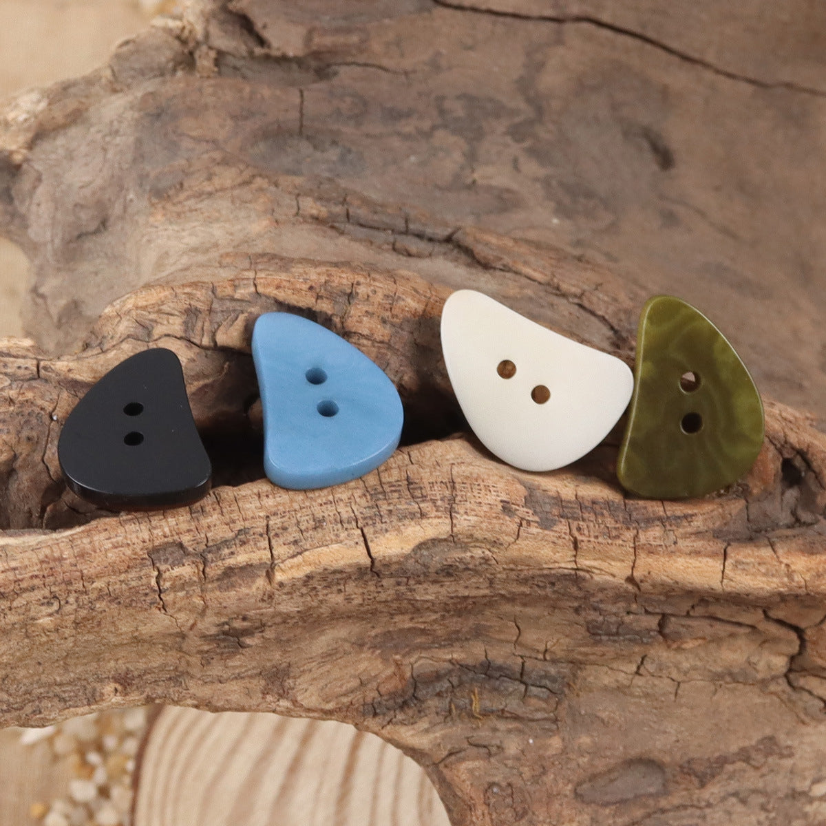 Crescent moon corozo buttons set with two holes in black, blue, white, green
