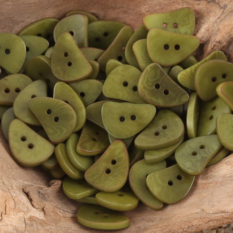 Green crescent moon corozo buttons with two holes, multiple pieces