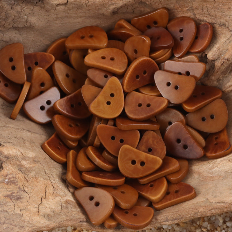 Brown crescent moon corozo buttons with two holes, mixed tones
