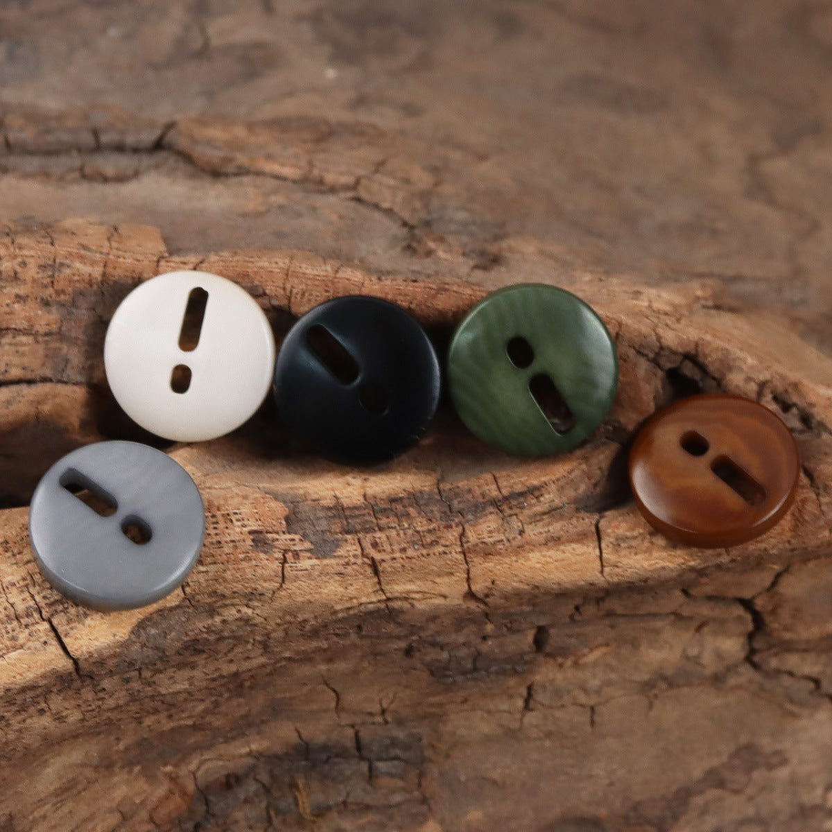 Palm fruit buttons with exclamation mark cutout in white, black, green, gray, and coffee brown.