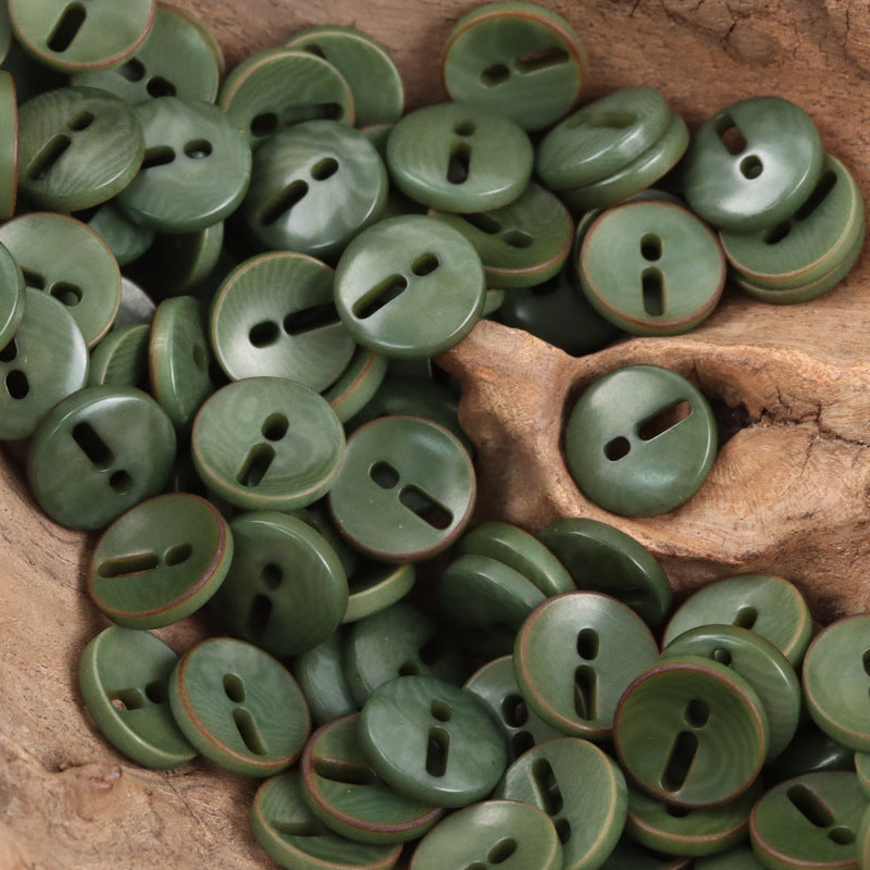 Green palm fruit buttons with exclamation mark cutout, round, 2-hole style look.