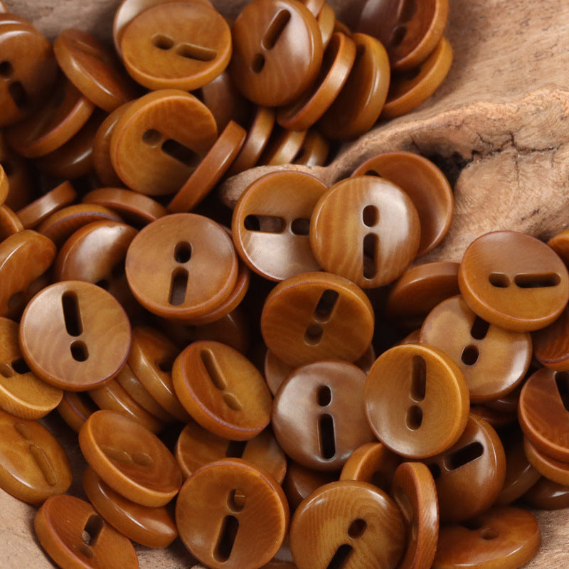 Brown palm fruit buttons with exclamation mark cutout, round, 2-hole style look.