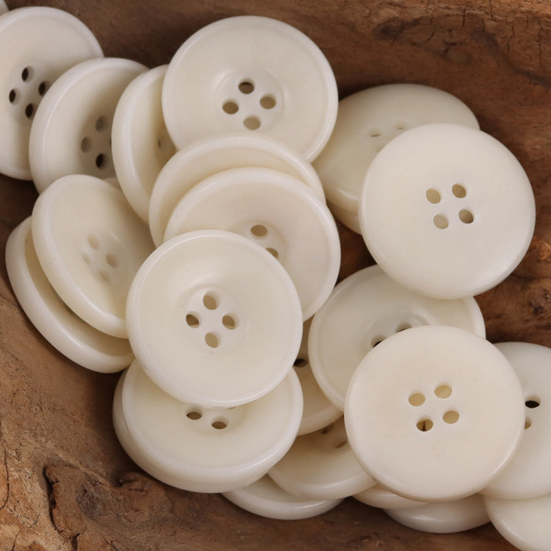 White bowl-shaped round nut buttons, 4-hole design, close pile