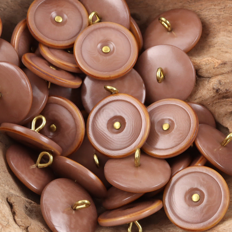 Pink coffee tagut nut buttons with golden shanks, burnt-edge rim, round 1-hole