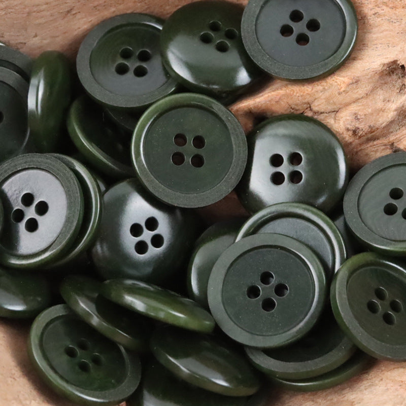 Dark green Tagut nut buttons, round design with 4 holes (mixed angles)
