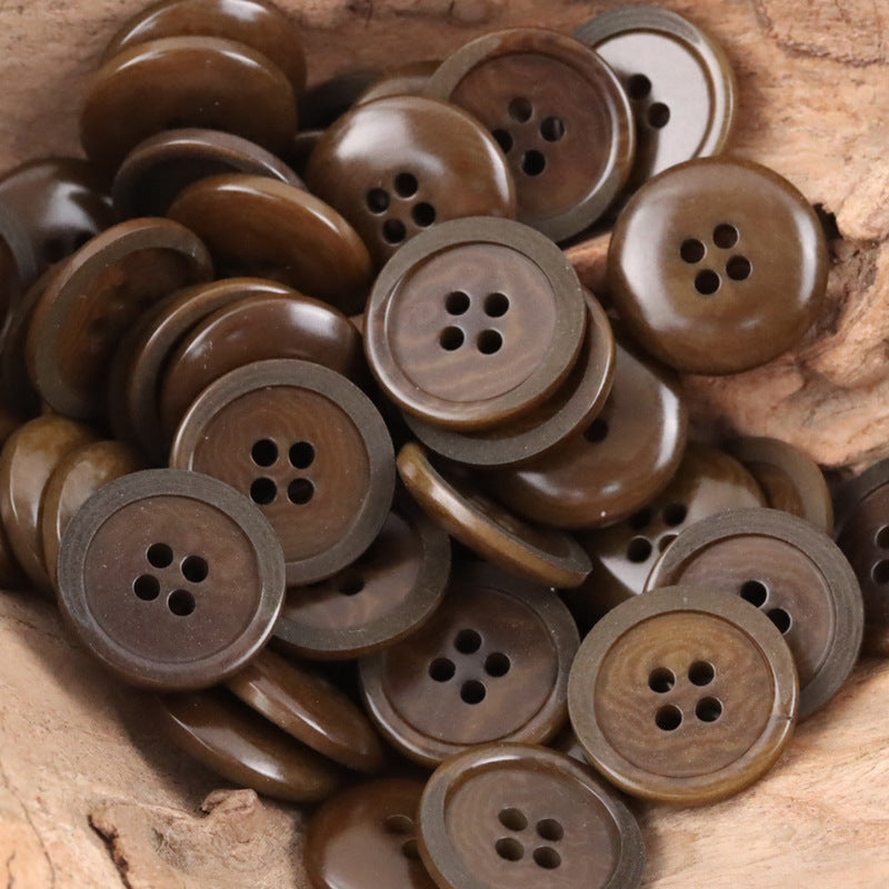 Deep coffee Tagut nut buttons, round pieces with 4 holes (assorted close-up)
