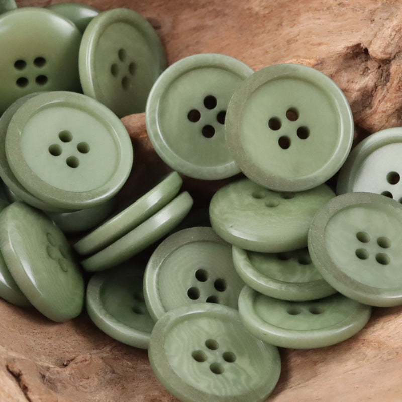 Light green Tagut nut buttons, multiple round pieces with 4 holes