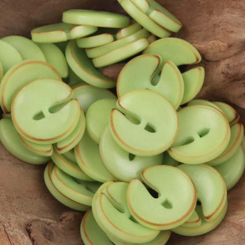 Pac-Man tagua nut buttons in light green, round face with two cutouts