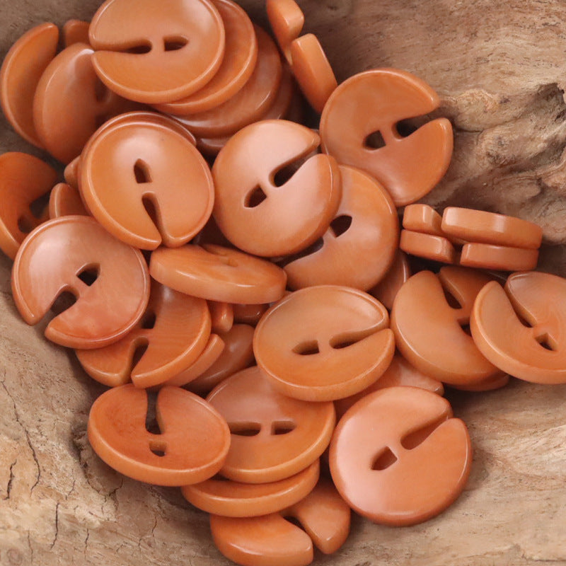 Pac-Man tagua nut buttons in Orange, round with two-hole face; set of 10