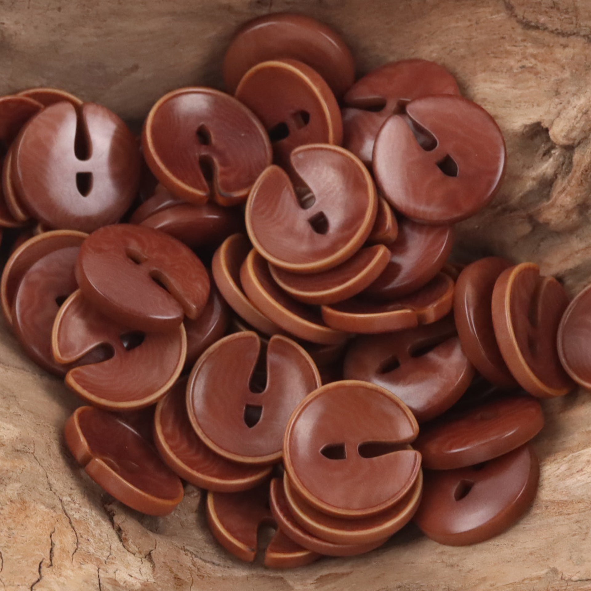 Pac-Man tagua nut buttons in warm brown and burnt orange tones