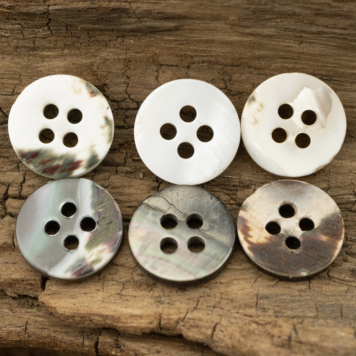 Round 11.5mm shell buttons, 4-hole—white, gray-silver, and bronze-brown tones (10).
