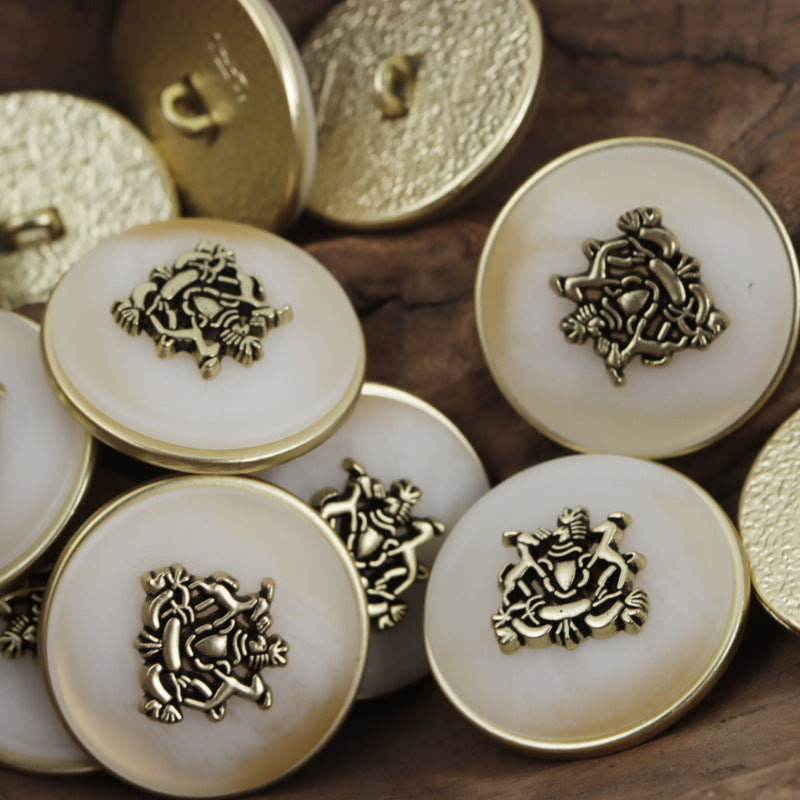 White round metal buttons with lion-and-crown emblem and gold-colored shanks