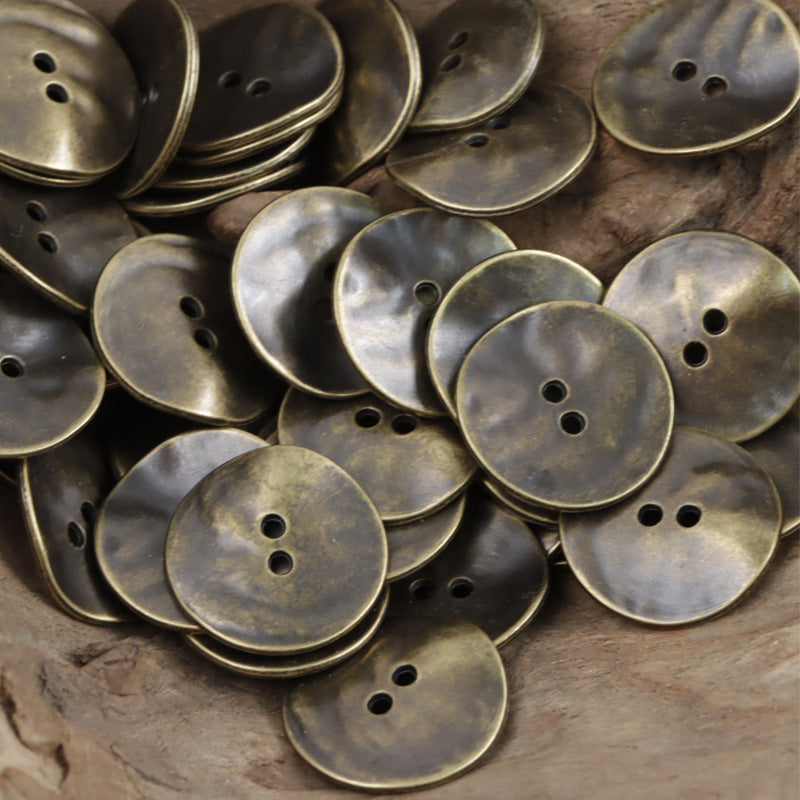 Assorted matte metal buttons in bronze and dark silver, round with 2–3 holes; 10-pack