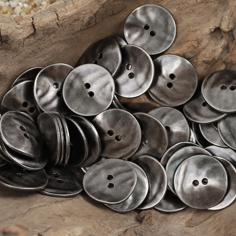 Stacked matte dark silver curved metal buttons, round with 2–3 holes; 10-pack