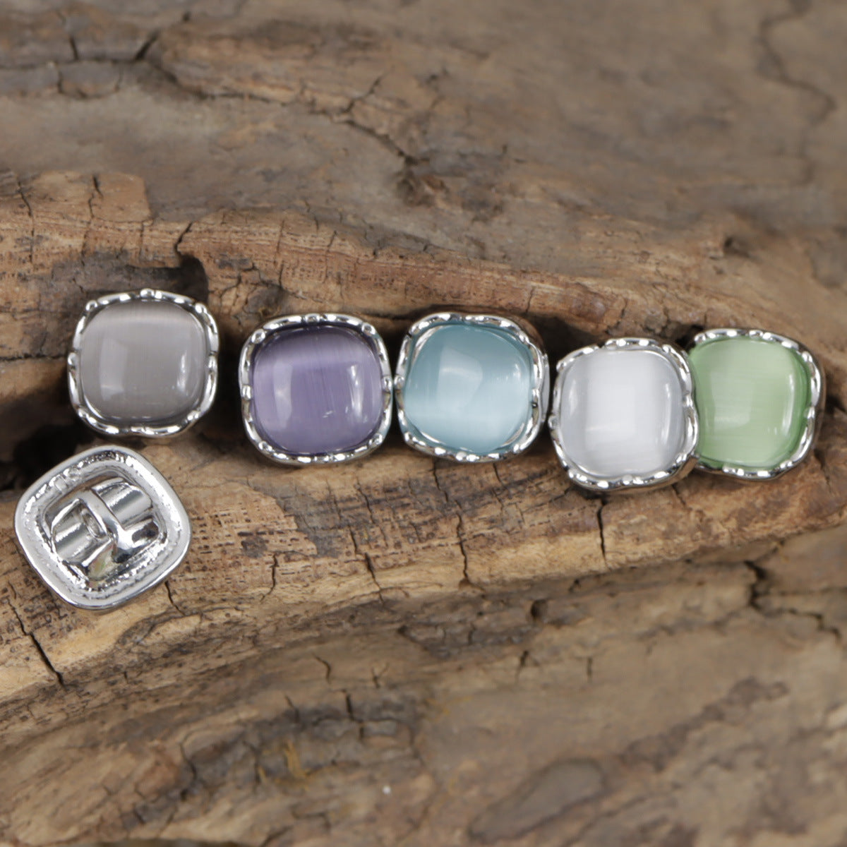 Pastel square jade buttons with metal rims: white, lavender, light blue, and green
