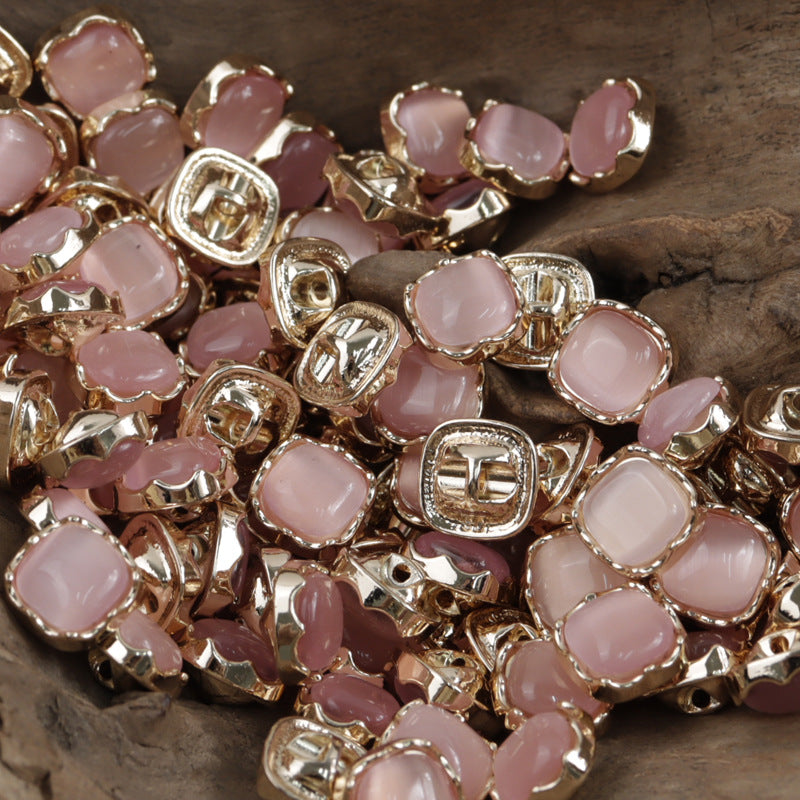 Pink square jade buttons with silver metal rims and recessed front enamel