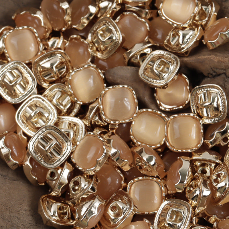 Cream-beige square jade buttons with silver metal rims and glossy enamel fronts