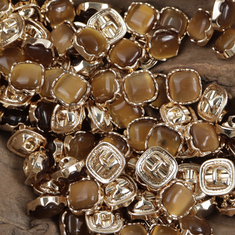 Brown/caramel jade-colored metal shank buttons, square gold-tone frames, 10mm